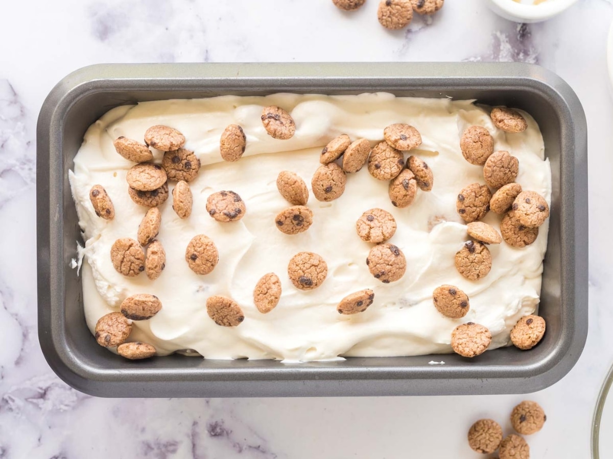 Chocolate chip ice cream mixture added to 9X5 loaf pan to freeze for no-churn ice cream.