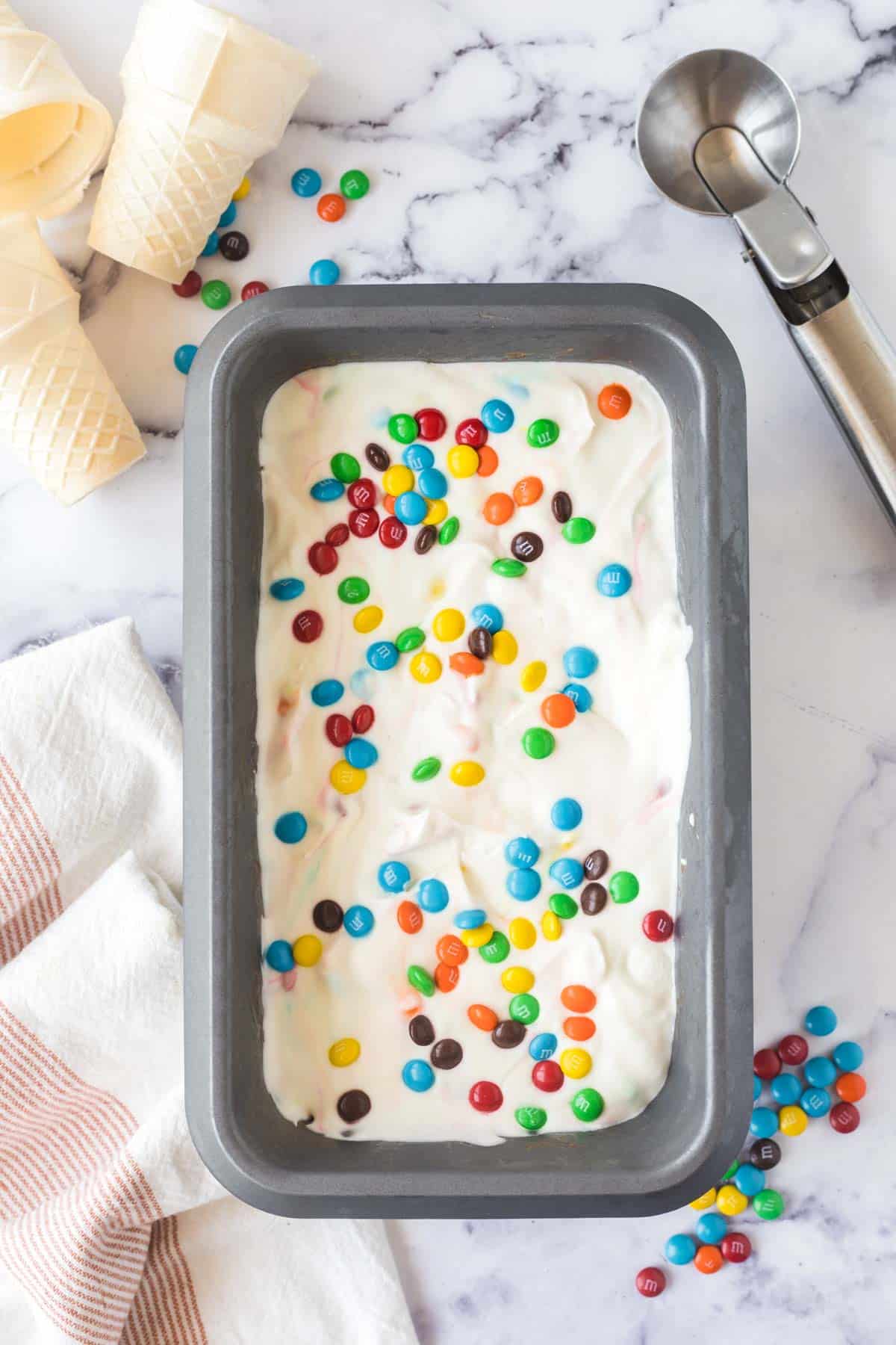 A pan filled with homemade M&M Ice Cream.