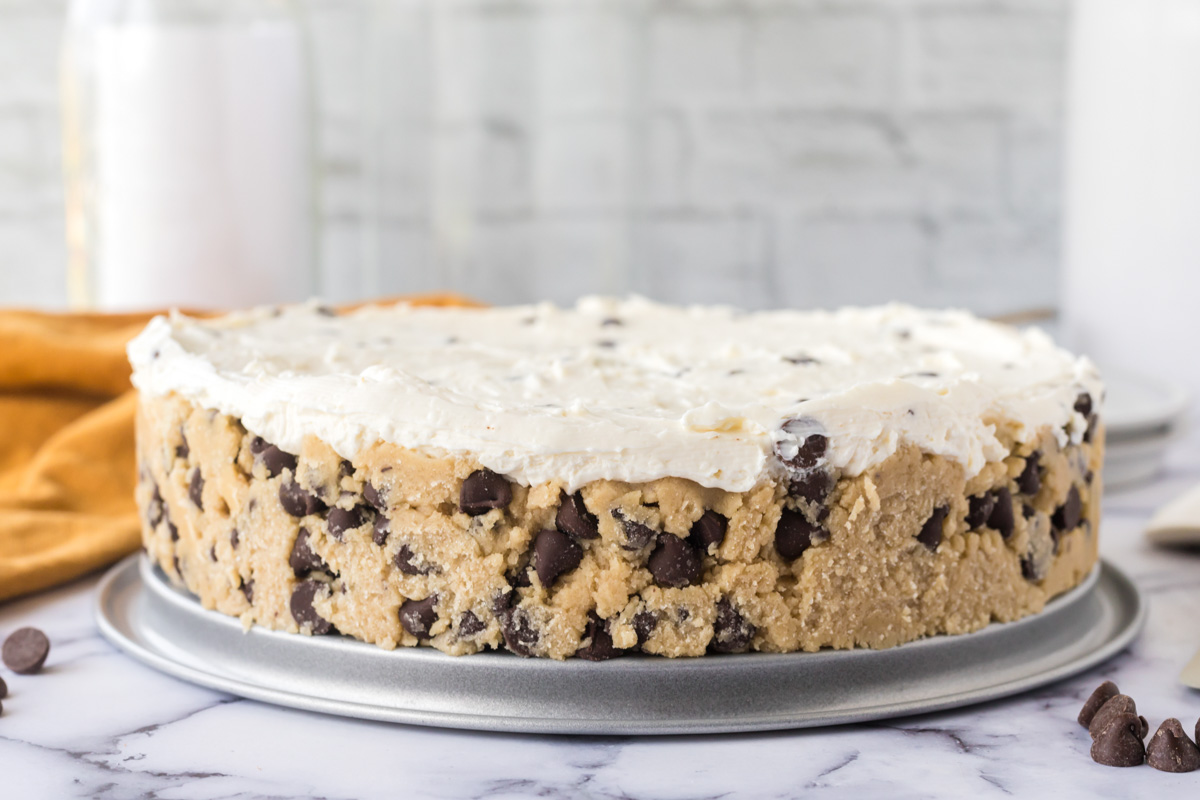 Up close side view of the whole cookie dough cheesecake.