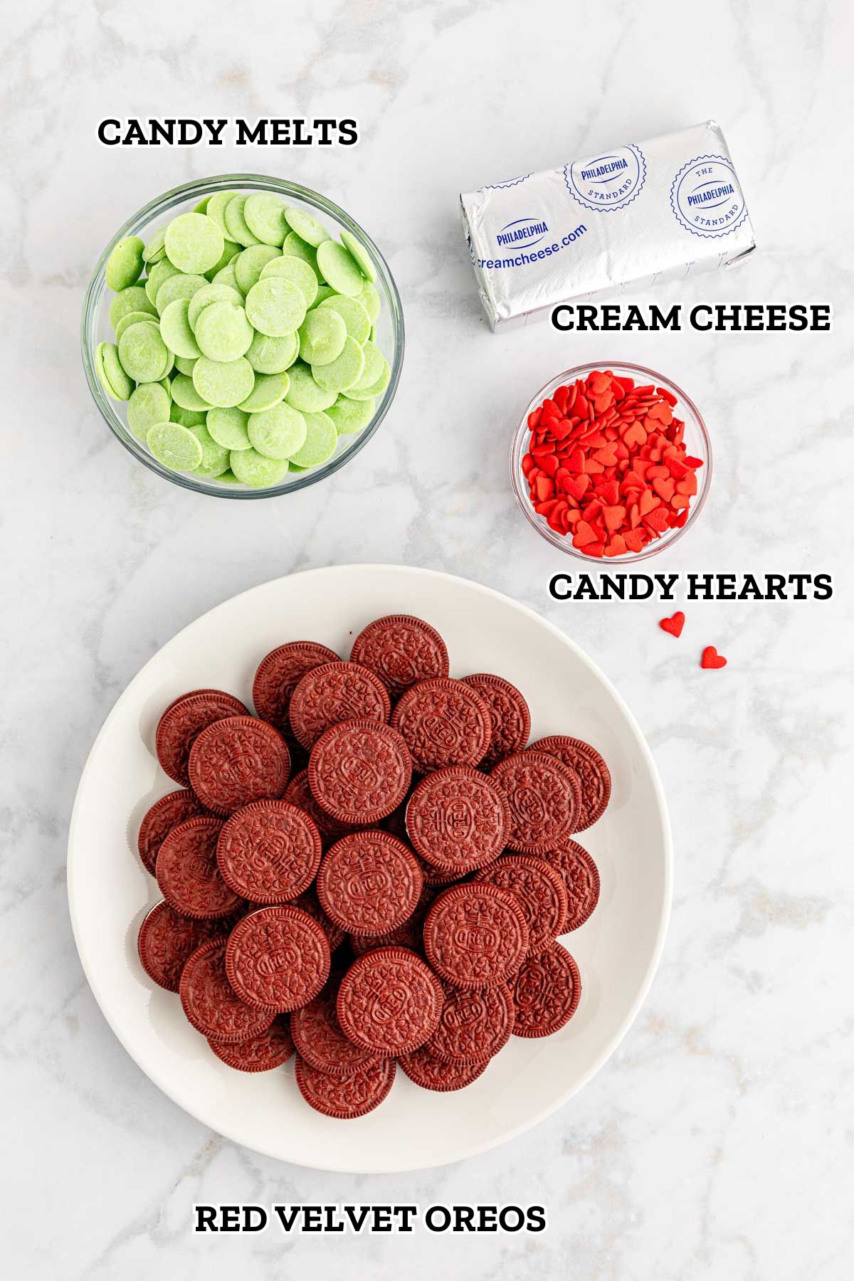 A labeled image of ingredients needed for Grinch Christmas Oreo Balls.