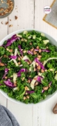 Image only Pinterest post for Kale Crunch Salad recipe in a white bowl and sitting on the counter topped with almonds.