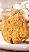 A hearty fork full of the three layers of the pumpkin pancakde recipe.
