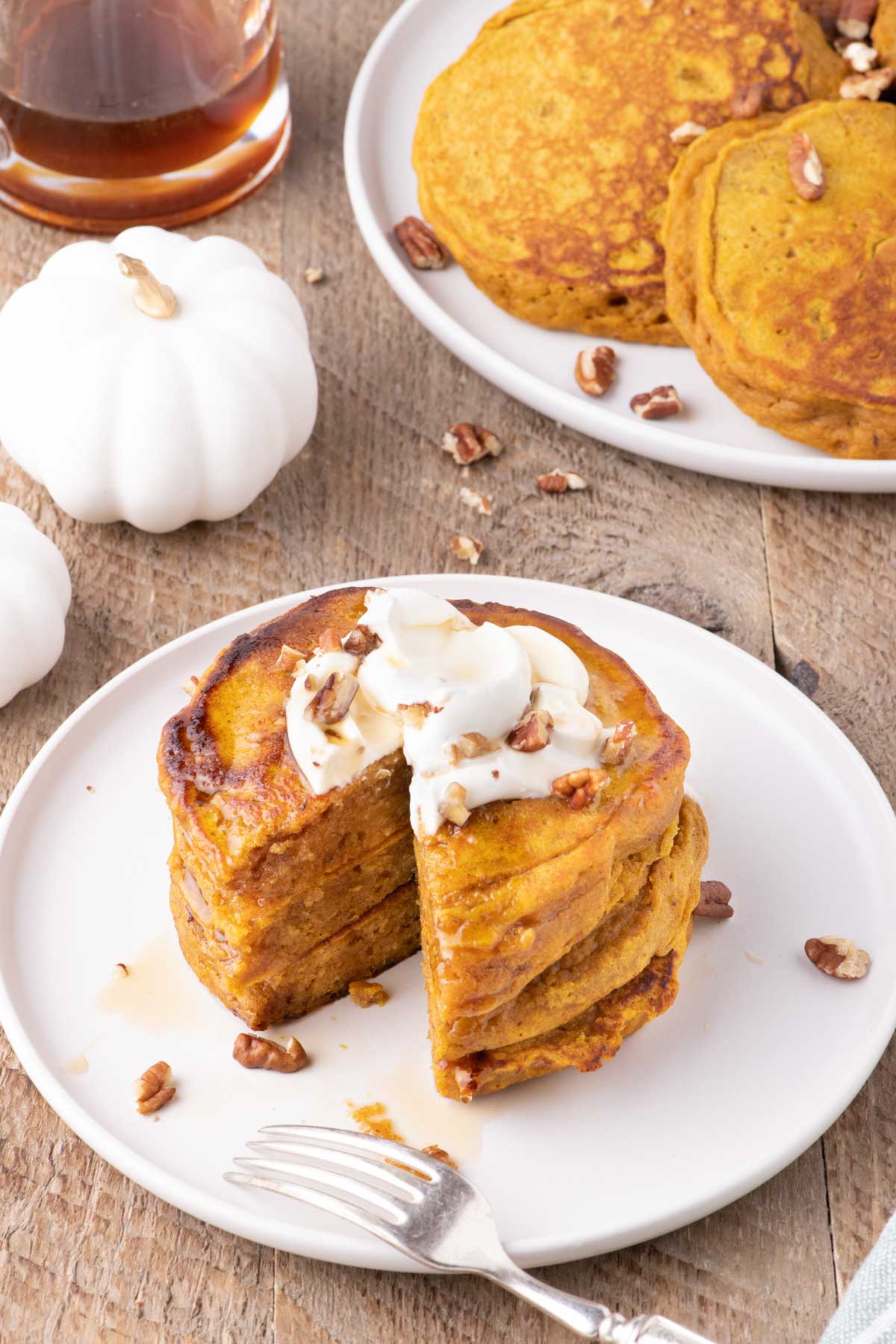 Pumpkin pancakes set on a fall tablescape.