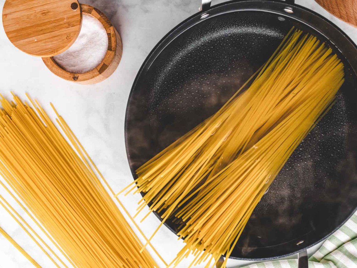 Pasta going into pot to boil.