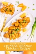 Semi-homeade Chinese Orange Chicken is serves on a white platter over white rice.