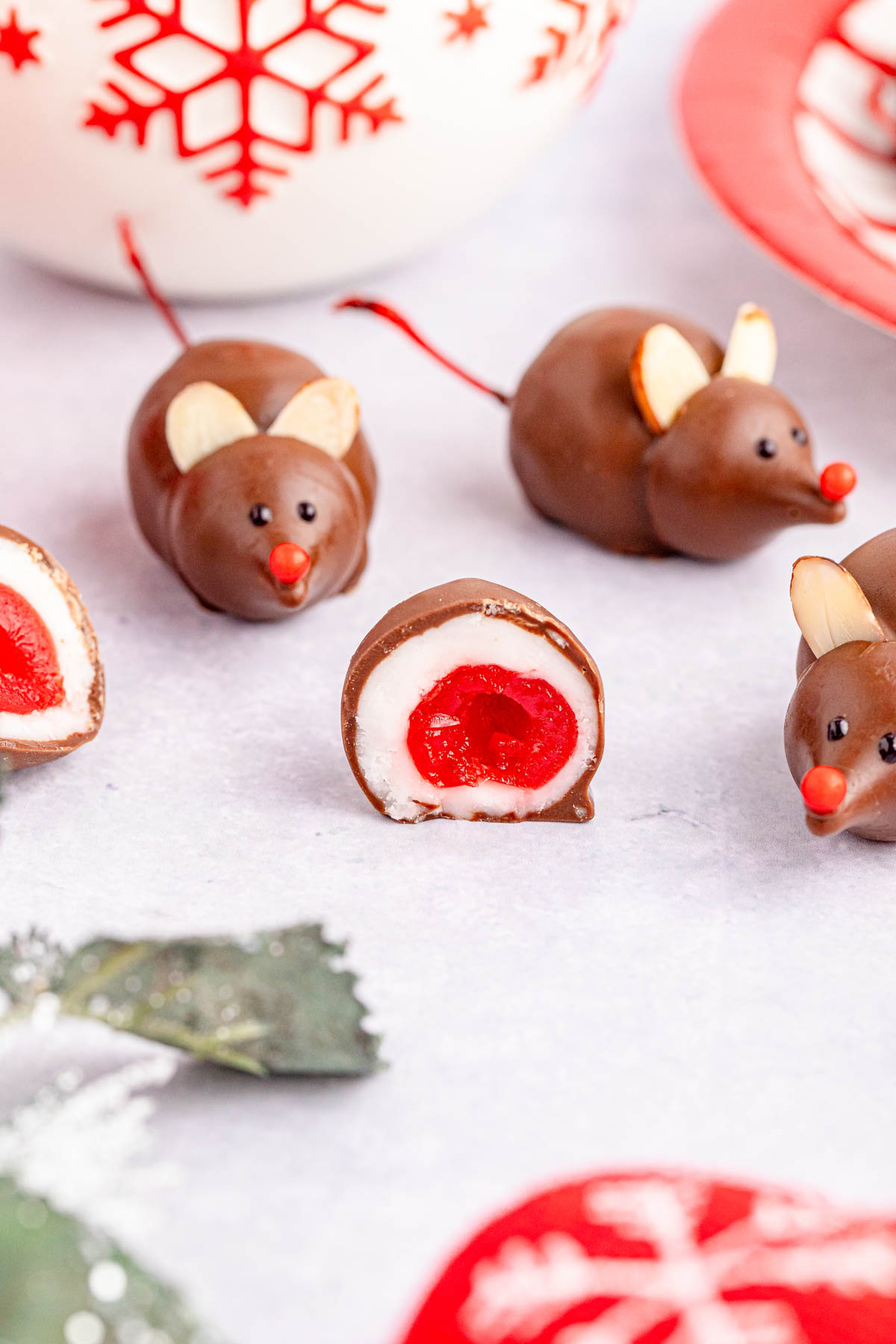 A chocolate covered cherry sliced open to shows inside layers.