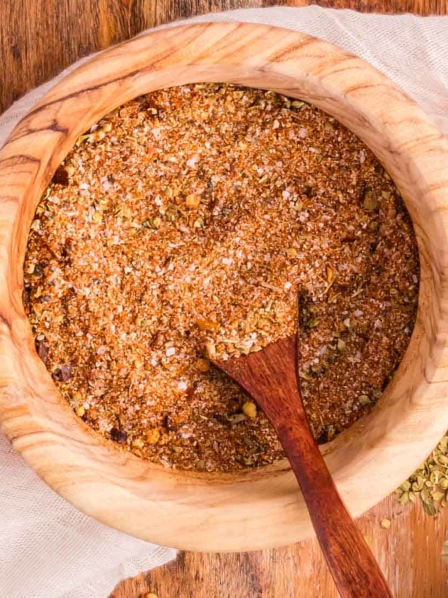 Homemade taco seasoning in a wooden bowl.