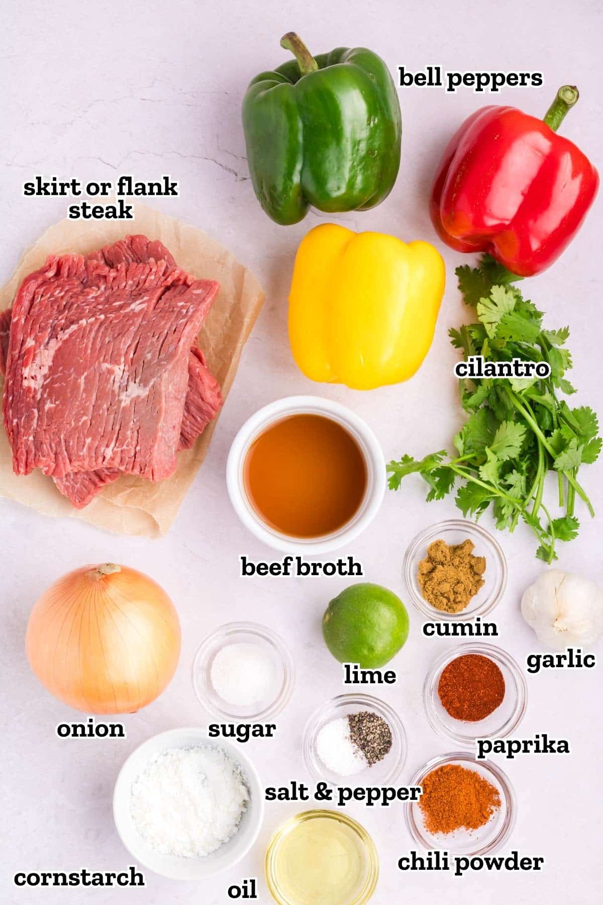 Labeled ingredients needed to make homemade steak fajitas.