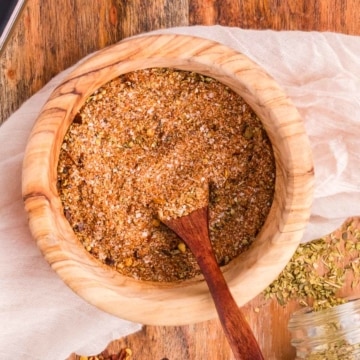 Homemade taco seasoning in a wooden bowl.
