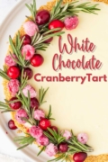 White Chocolate Cranberry Tart image of half of the tart and garnished for Christmas.