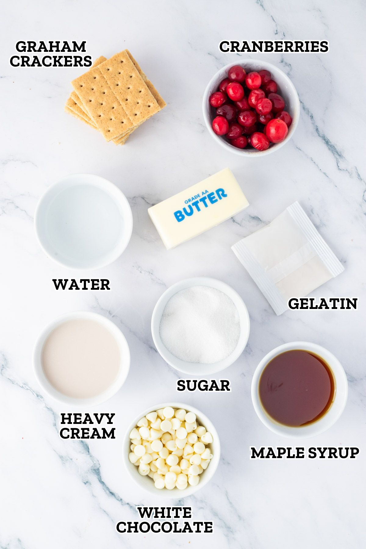 The ingredients for the cranberry sauce are laid out on a marble surface.