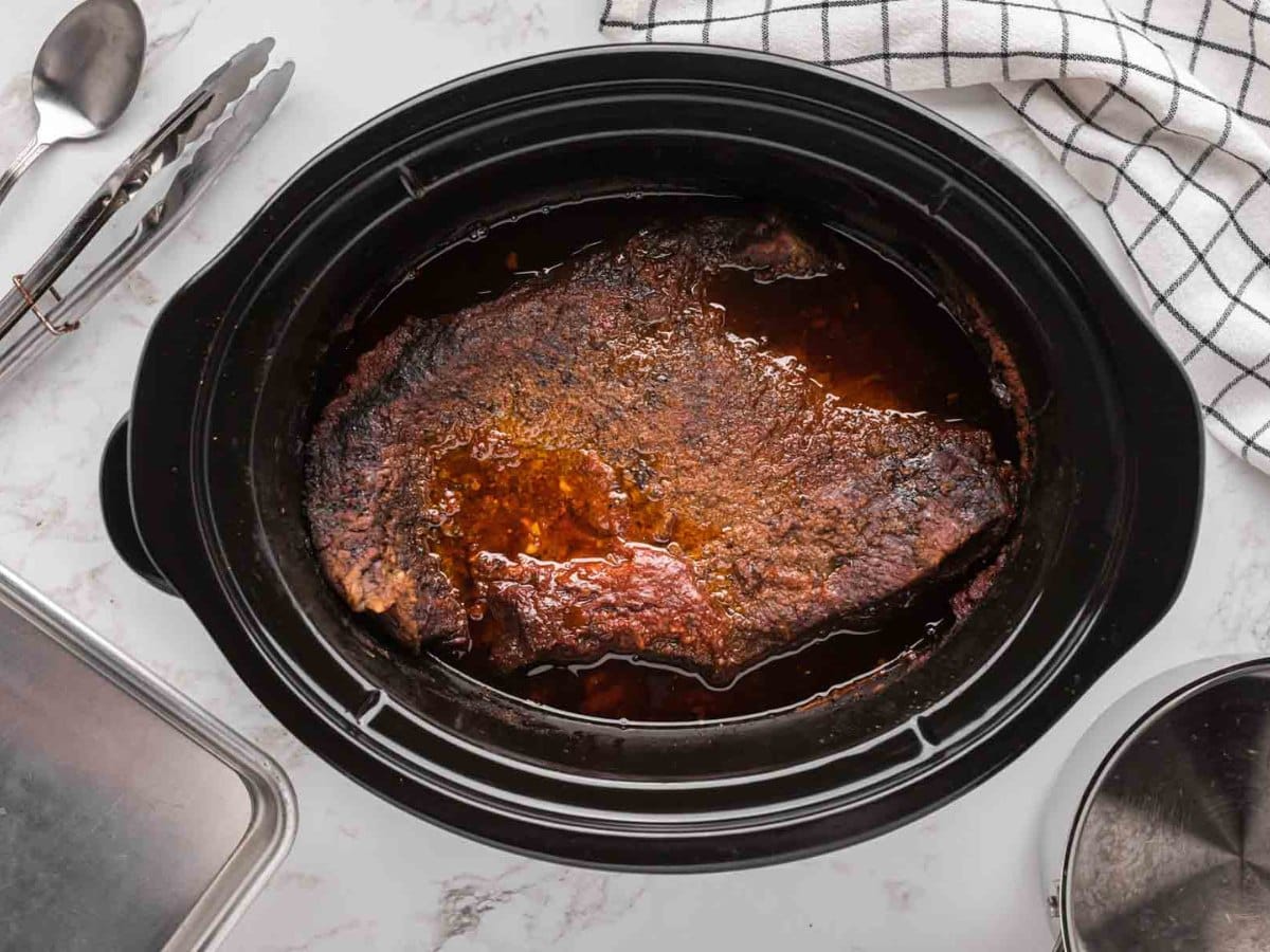 Beef brisket in crock pot after cooking all day.