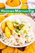 Neiman Marcus Million Dollar Dip in a white bowl with Ritz Crackers surrounding.