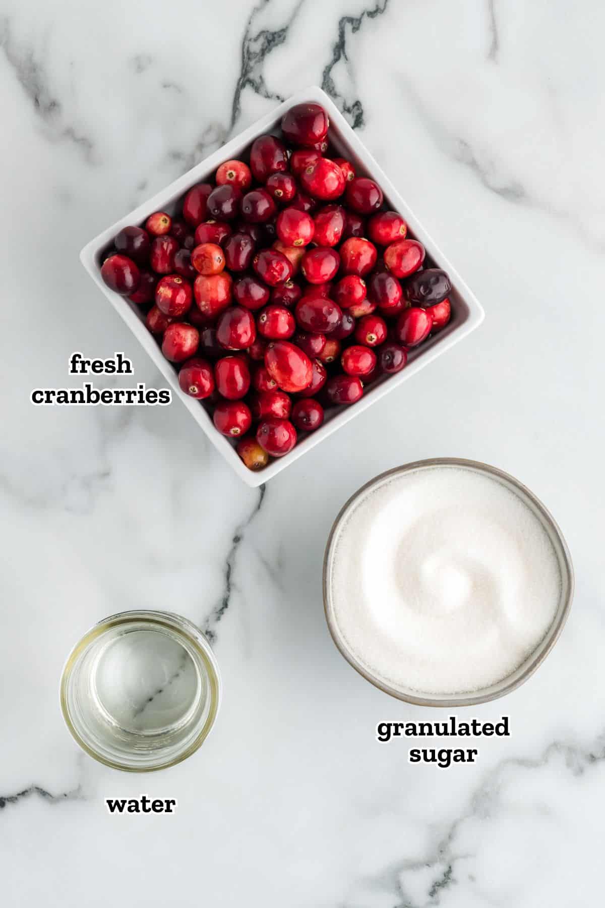 Labeled ingredients needed to make sugared cranberries.