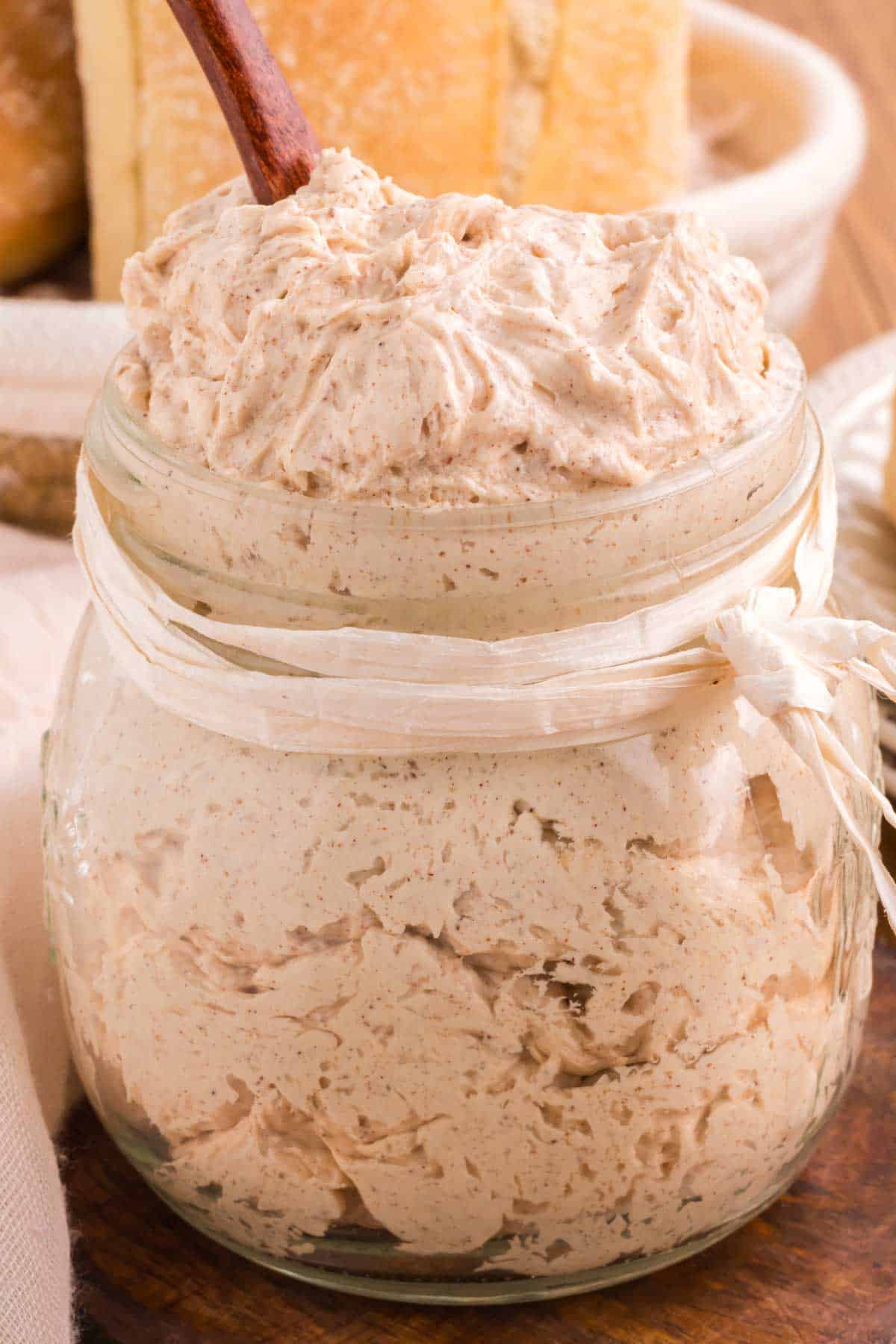 Whipped cinnamon honey butter in a glass jar.