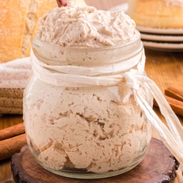 Whipped copycat Texas Roadhouse cinnamon honey butter in a glass jar.