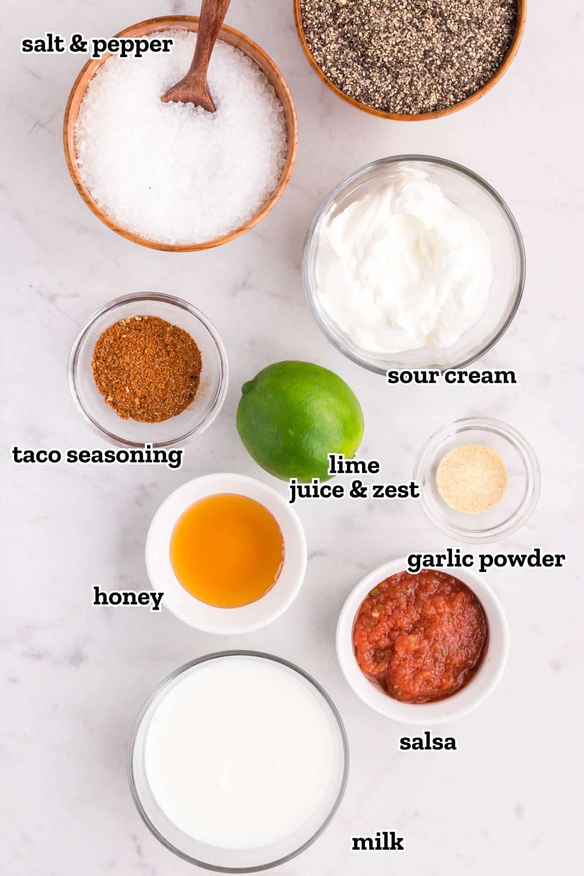 Labeled ingredients needed to make creamy lime dressing.