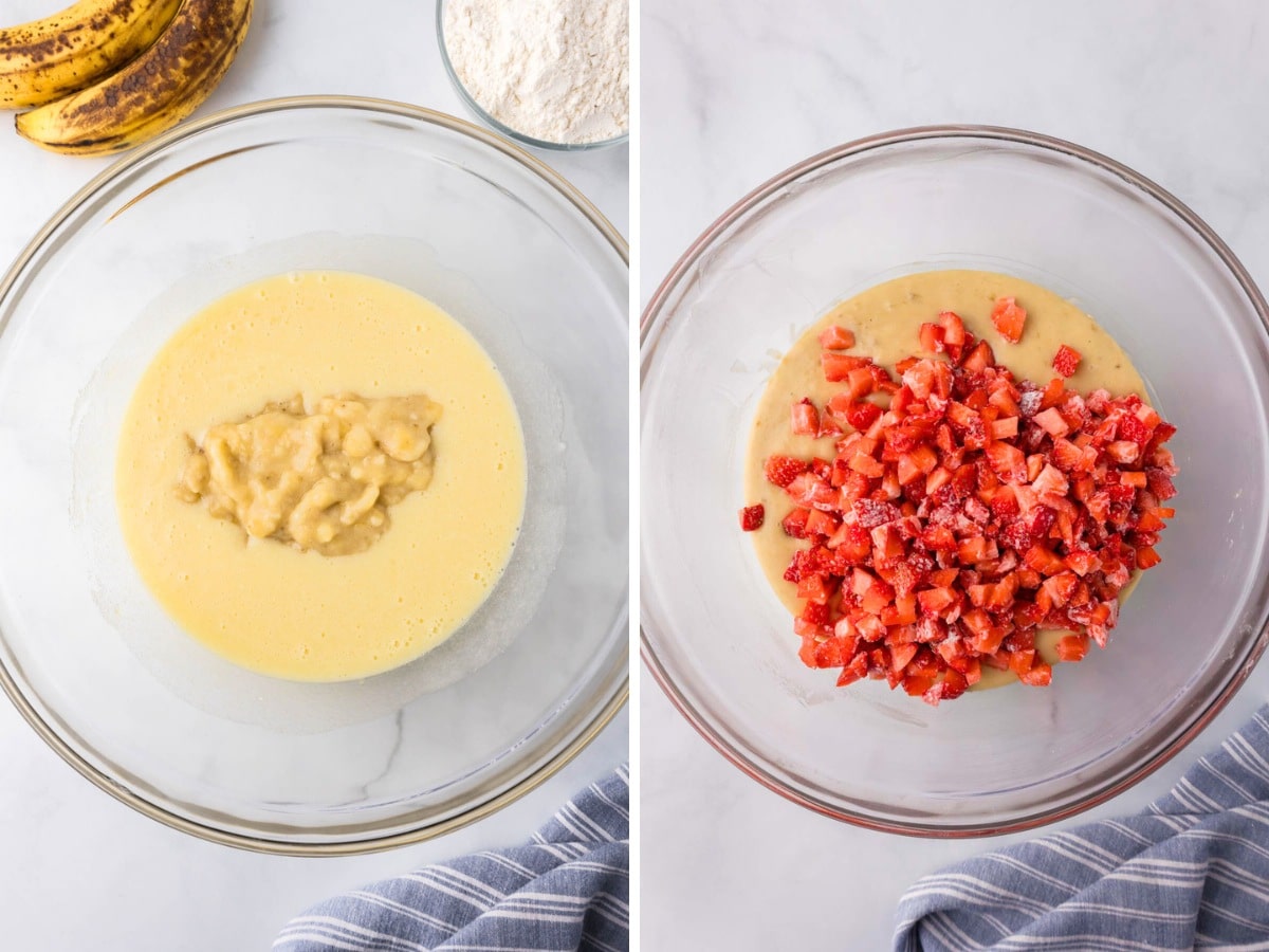 A clear bowl with batter adding in chopped bananas and flour coated strawberries.