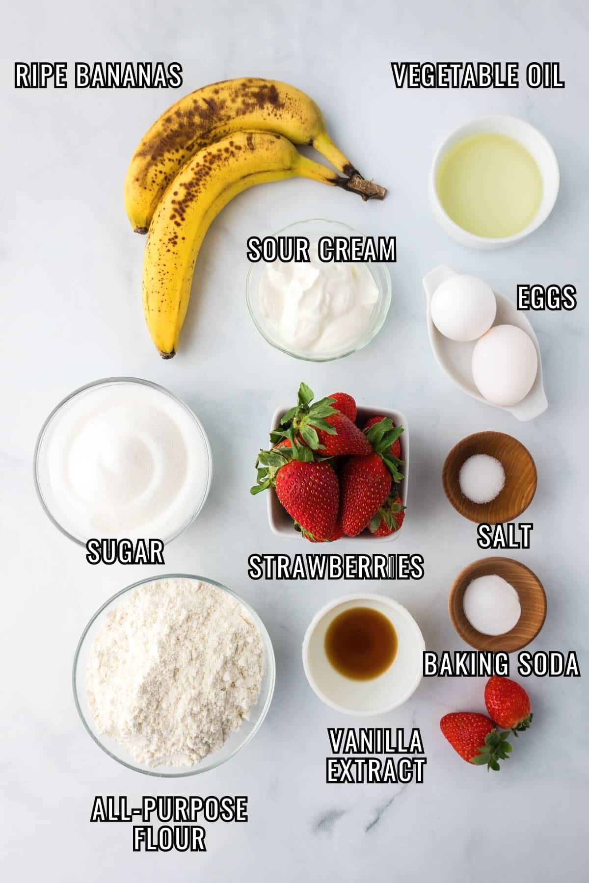 Labeled ingredients needed to make homemade strawberry banana bread recipe.