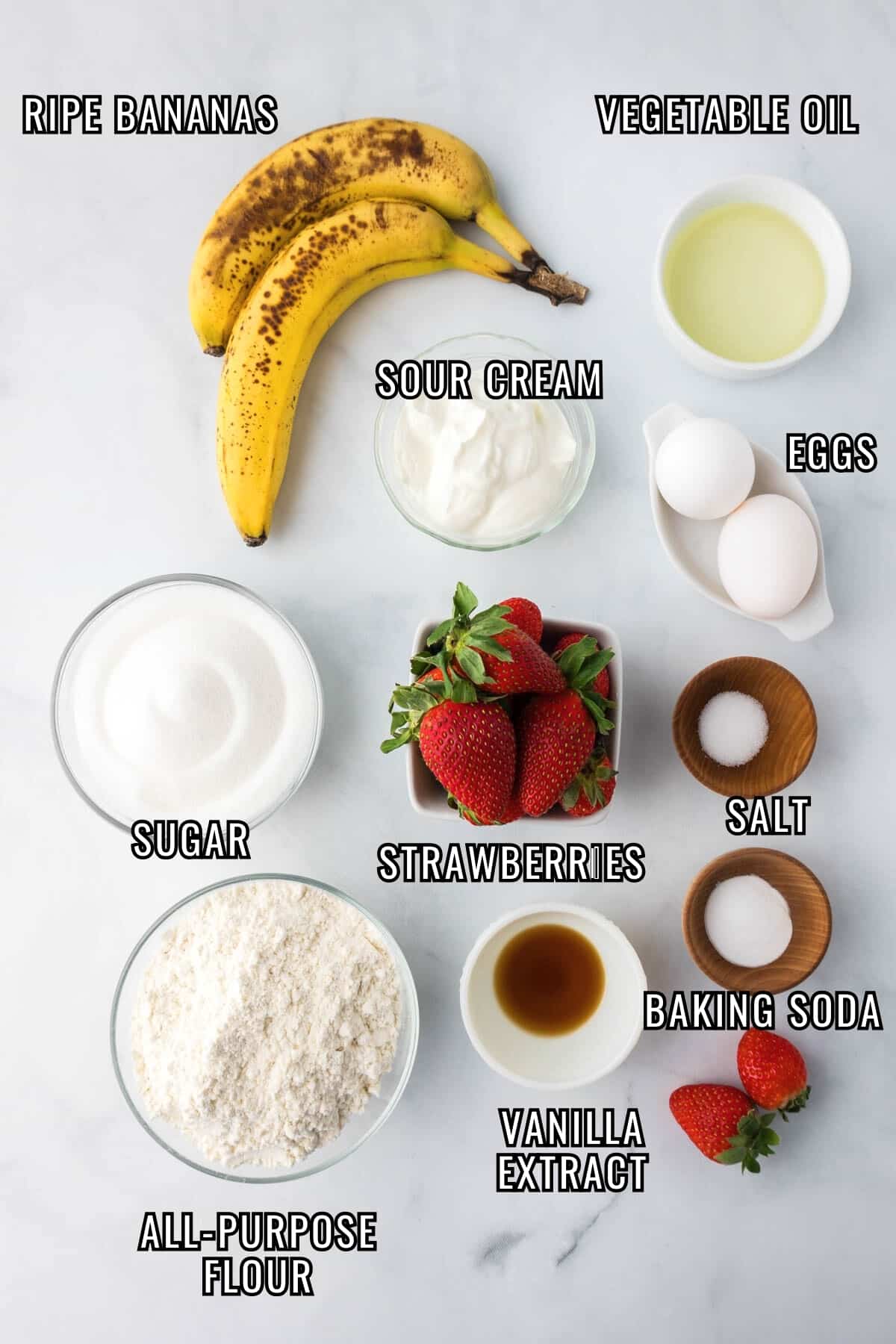Labeled ingredients needed to make homemade strawberry banana bread recipe.
