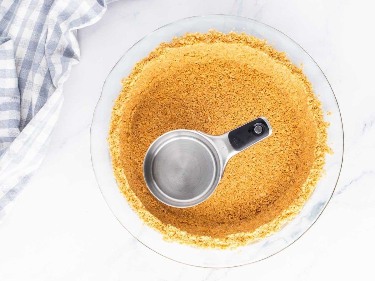 Graham cracker crumbs pressed into pie dish.