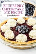 Blueberry Cheesecake Pie Recipe pin 2 of an entire pie topped with whipped cream.