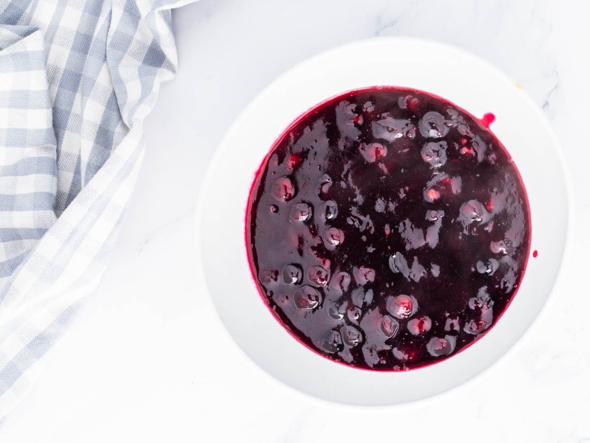 Chilled blueberry pie filling in a white bowl.