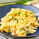 A serving of chicken noodle casserole on a blue plate.