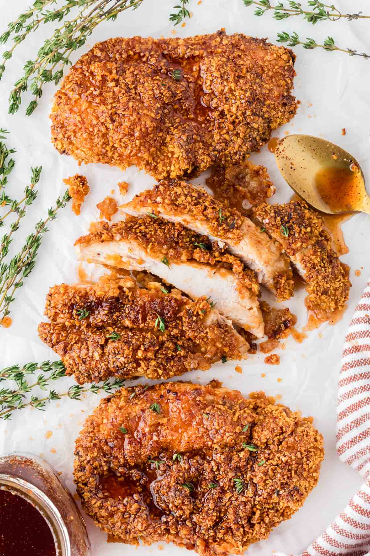 Hot honey chicken breasts with one of the pieces sliced.