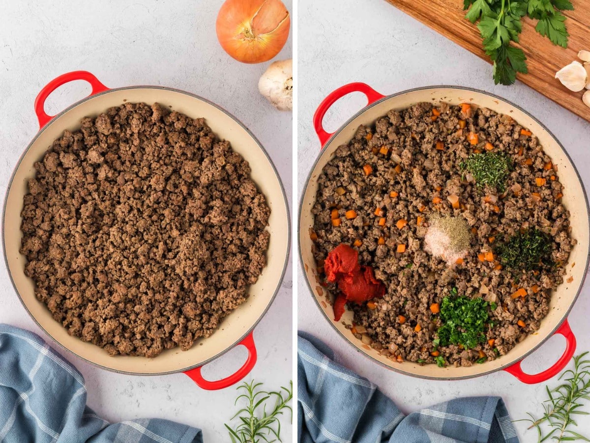 Cooked ground beef in a pot with diced carrots, tomato paste and spices added.