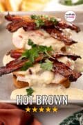 Kentucky Hot Brown sandwich on a baking sheet garnished with cilantro.