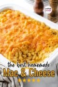A white casserole dish full of the best homemade macaroni and cheese is featured from above.