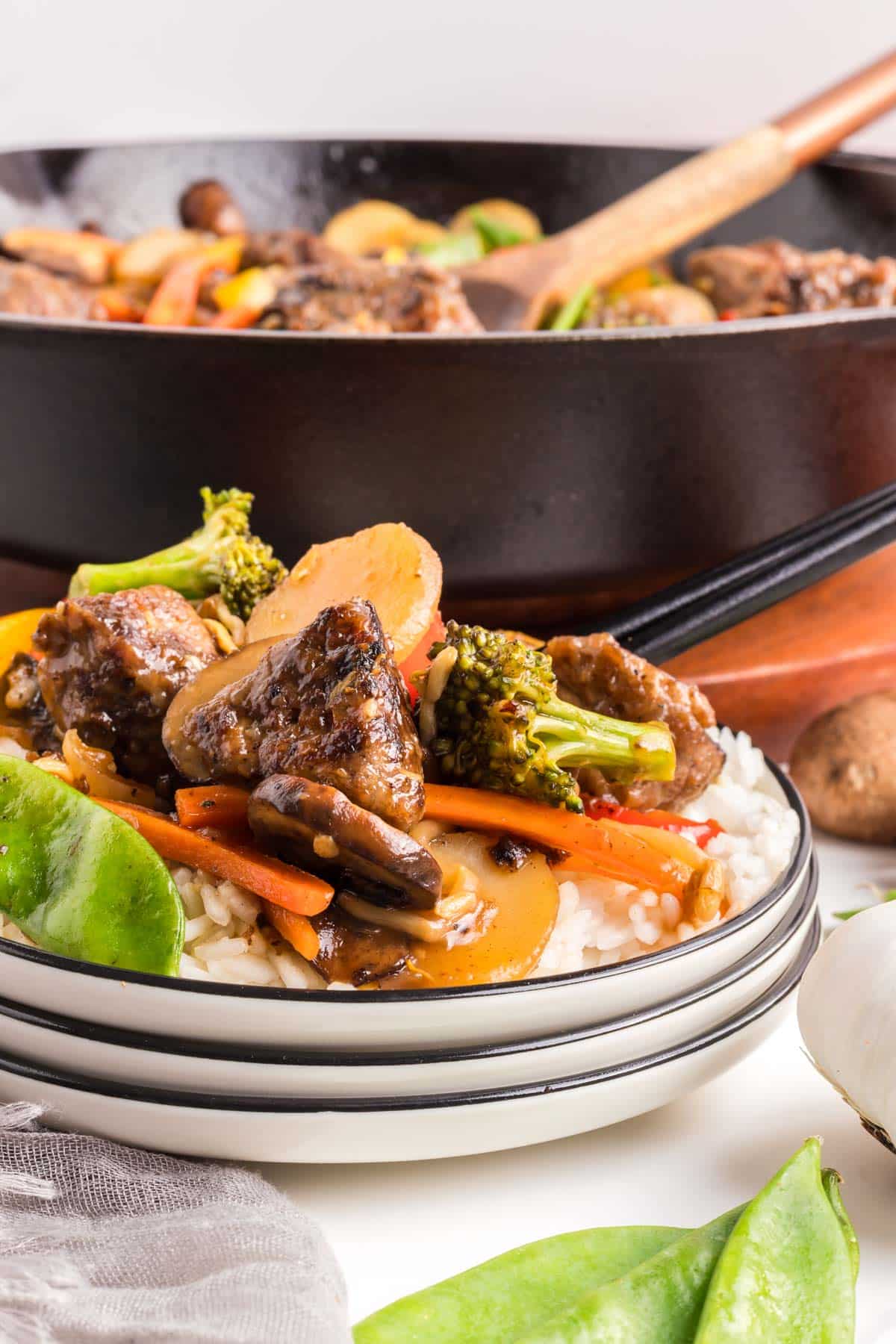Beef steak chopped suey plated with the serving pan in the background.