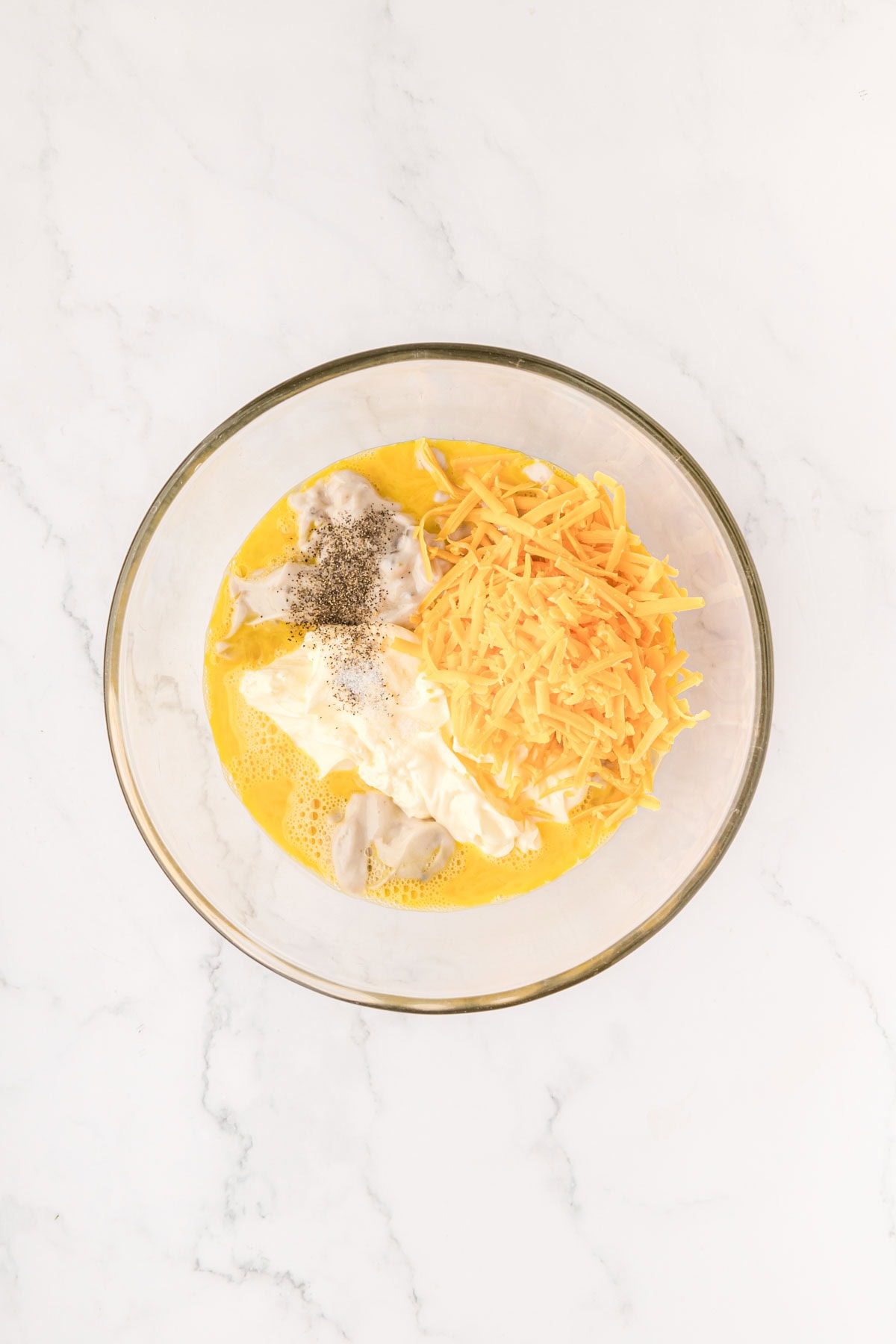 Filling ingredients added to a bowl.