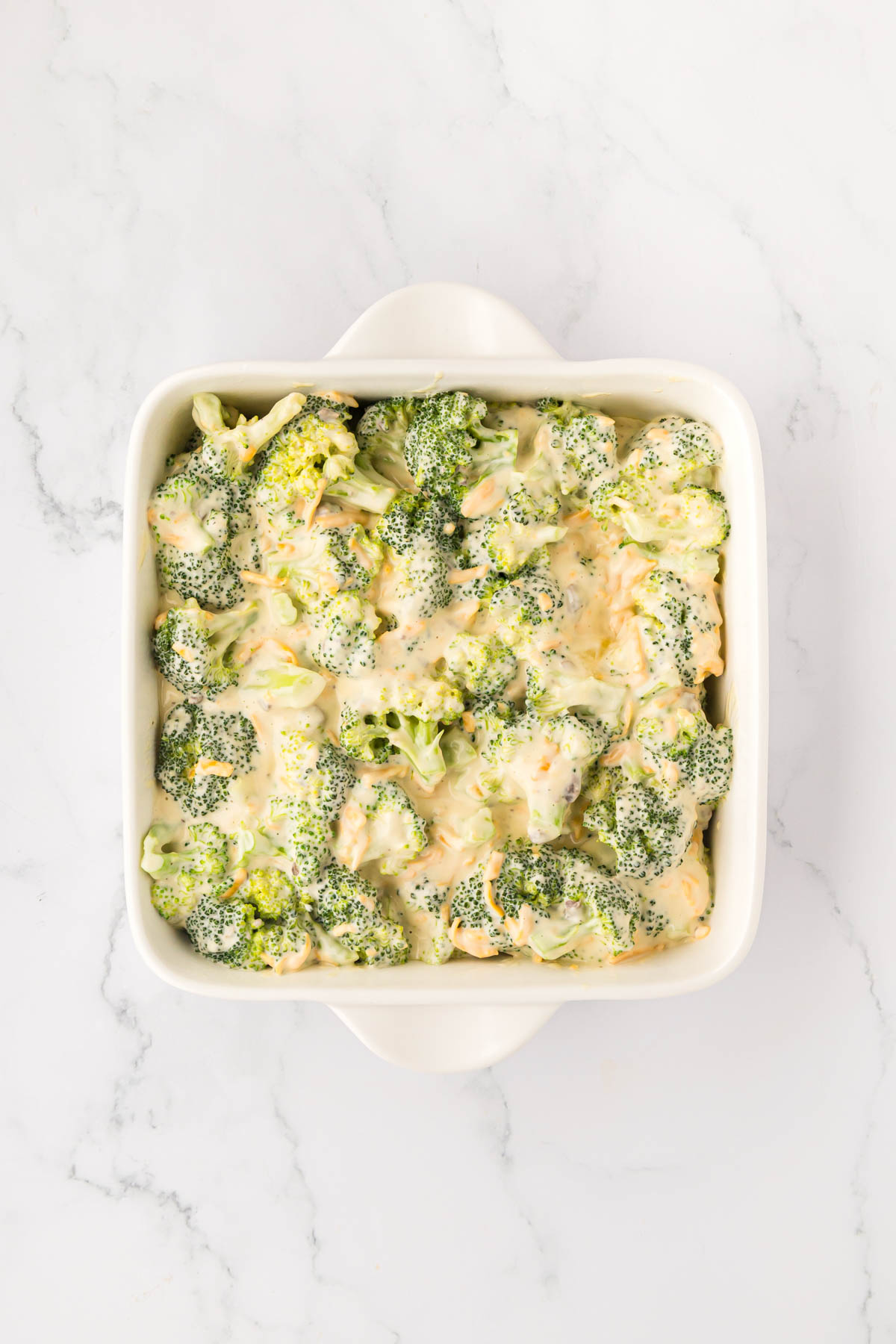 Broccoli casserole mixture poured in a casserole dish.