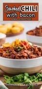 Side view image of the Smoked Chili with Bacon bowl full topped with Fritos and sour cream.
