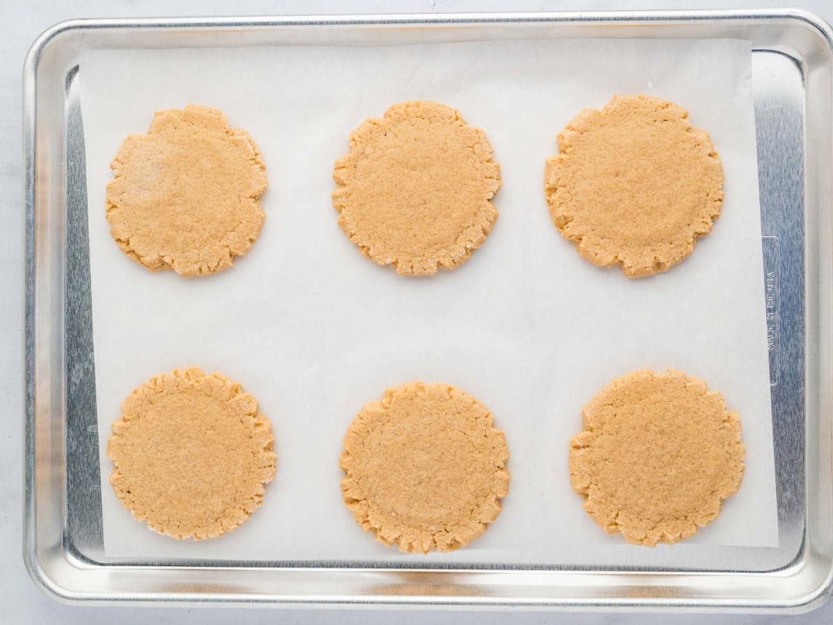 Cookie butter cookies on a baking sheet after being baked.
