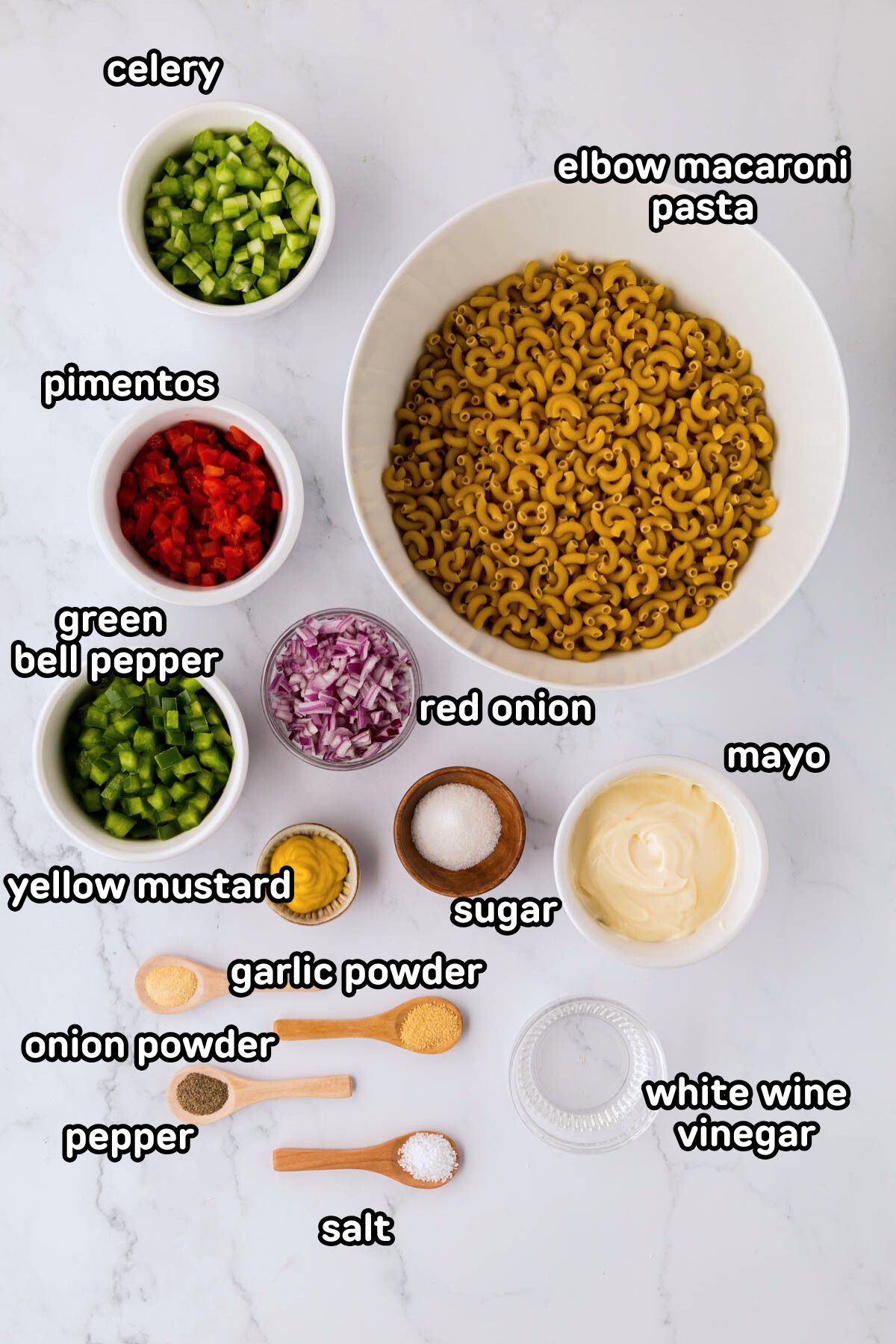 Labeled photo of the ingredients needed to make macaroni salad.