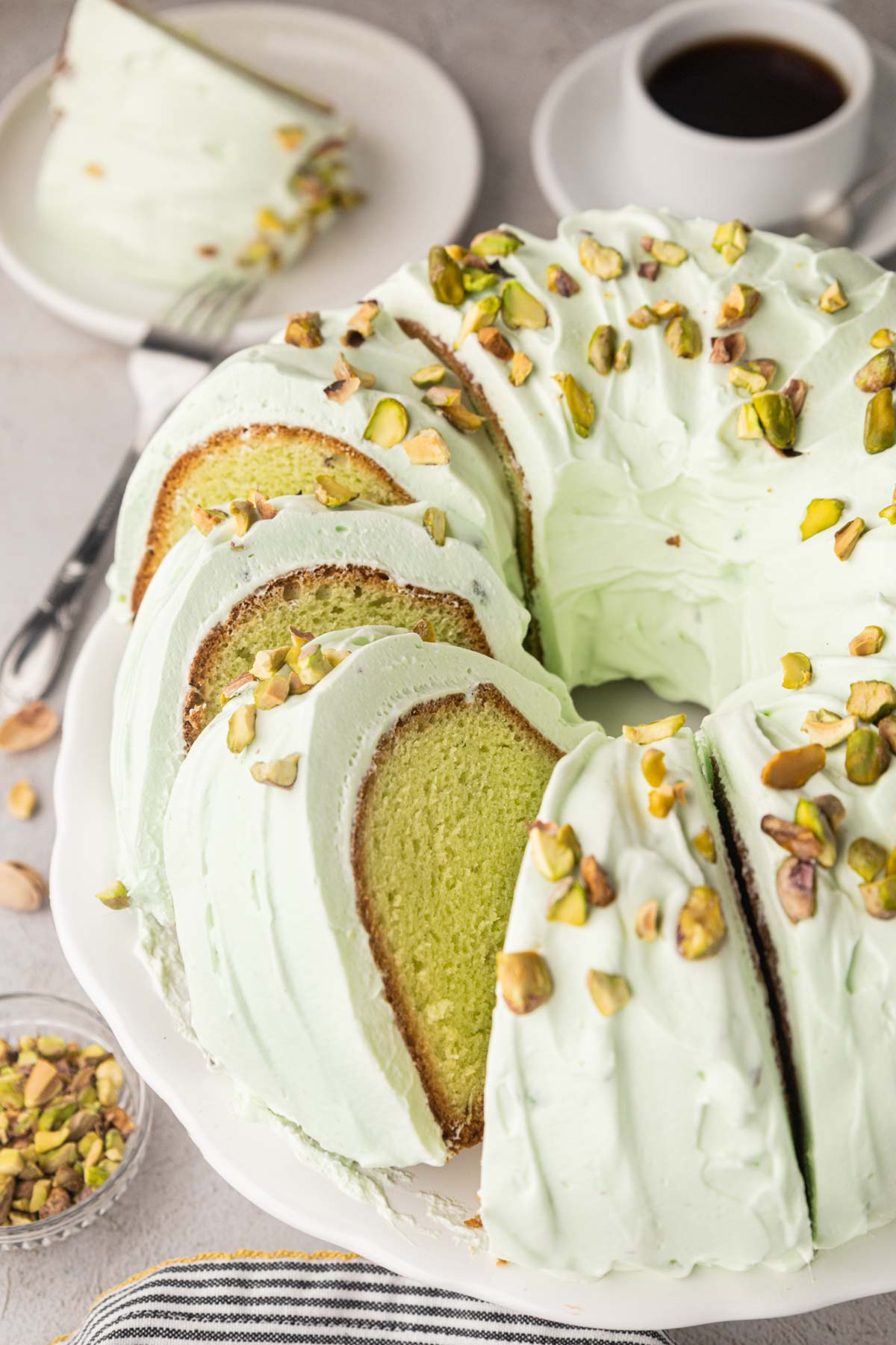 Sliced pistachio pudding cake.