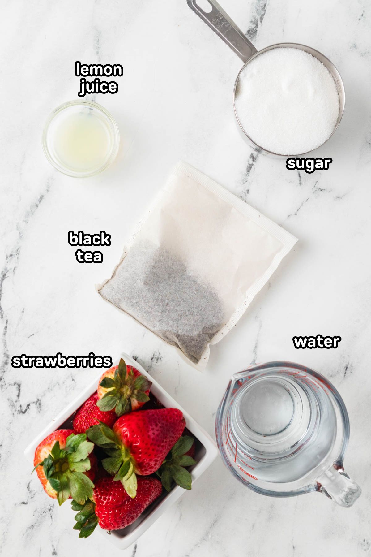 Labeled photo of ingredients needed to make Southern strawberry sweet iced tea.
