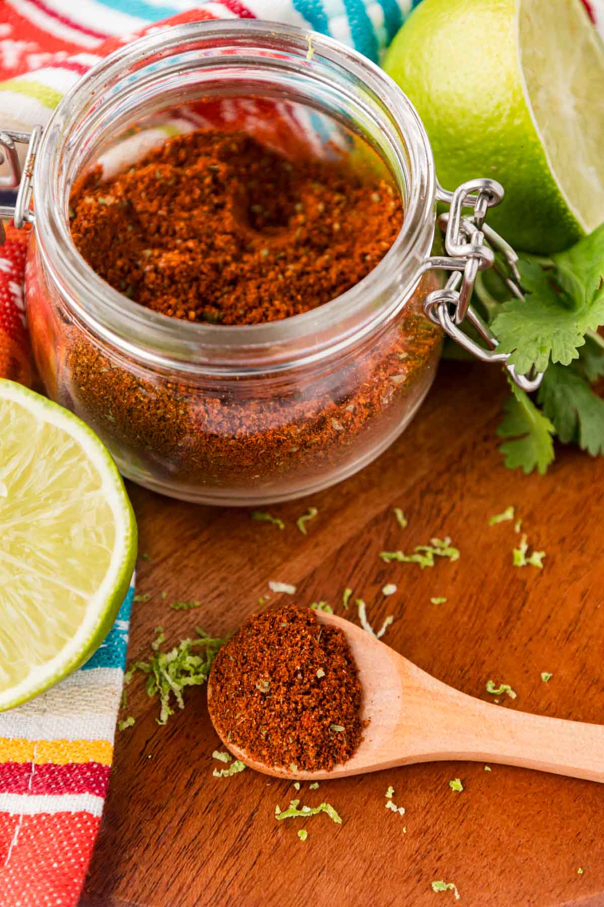 Wooden spoon with a scoop of Elote seasoning in it.