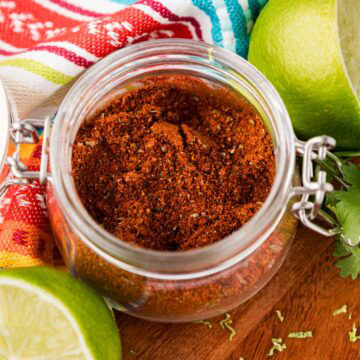 Homemade elote seasoning in a glass jar.