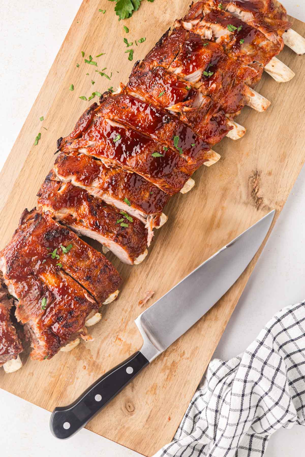 Barbecue ribs on a wooden tray.