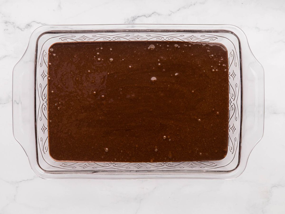 Cake batter in a 9 x 13 pan.