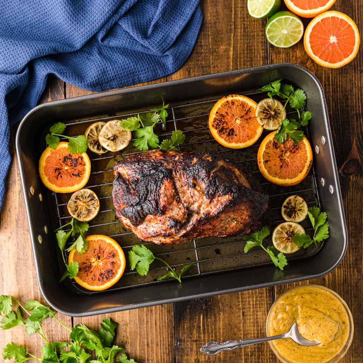 Overhead shot of roasted Cuban pork on a roasting pan.