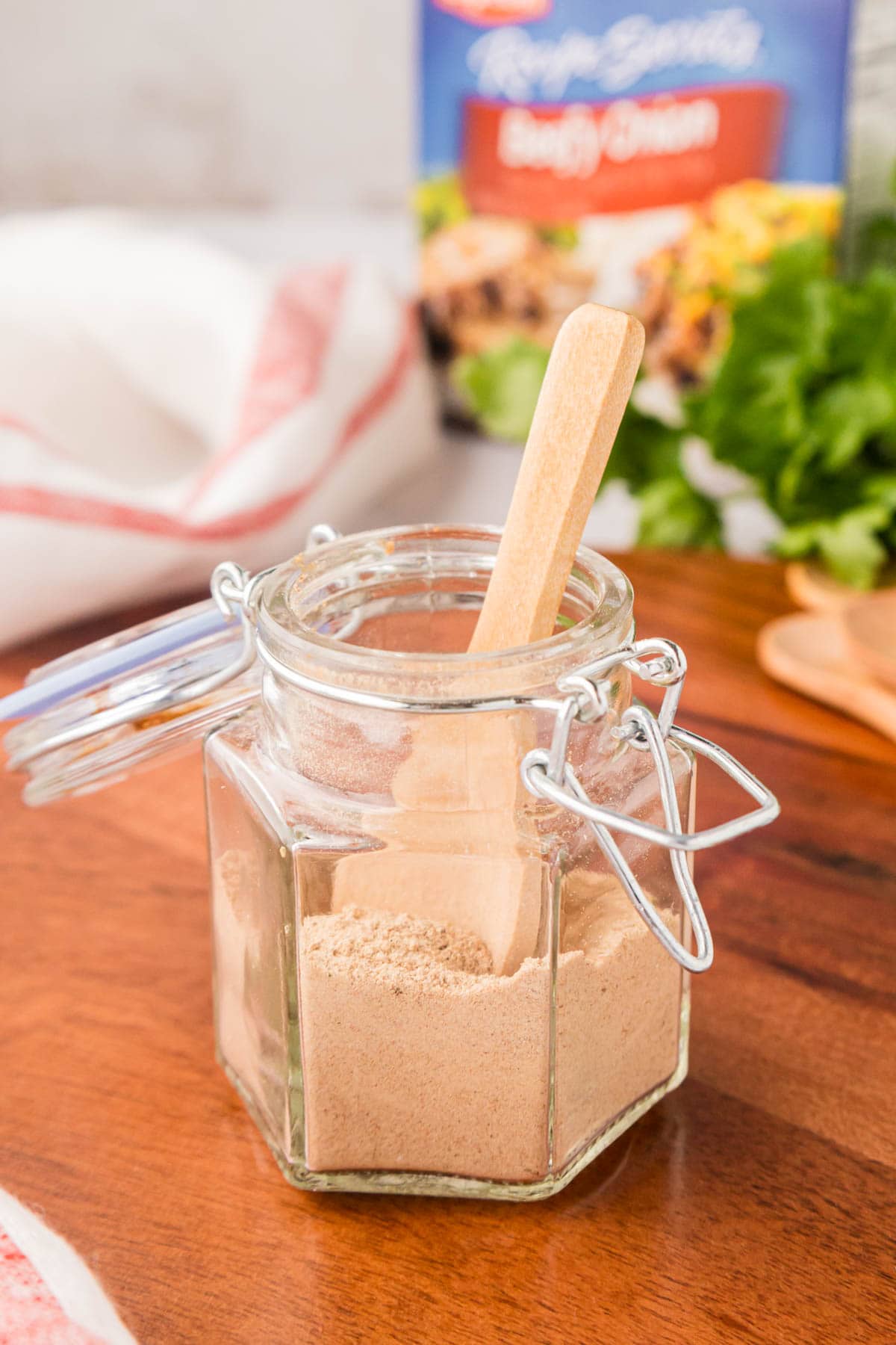 A glass spice jar of homemade onion soup mix.