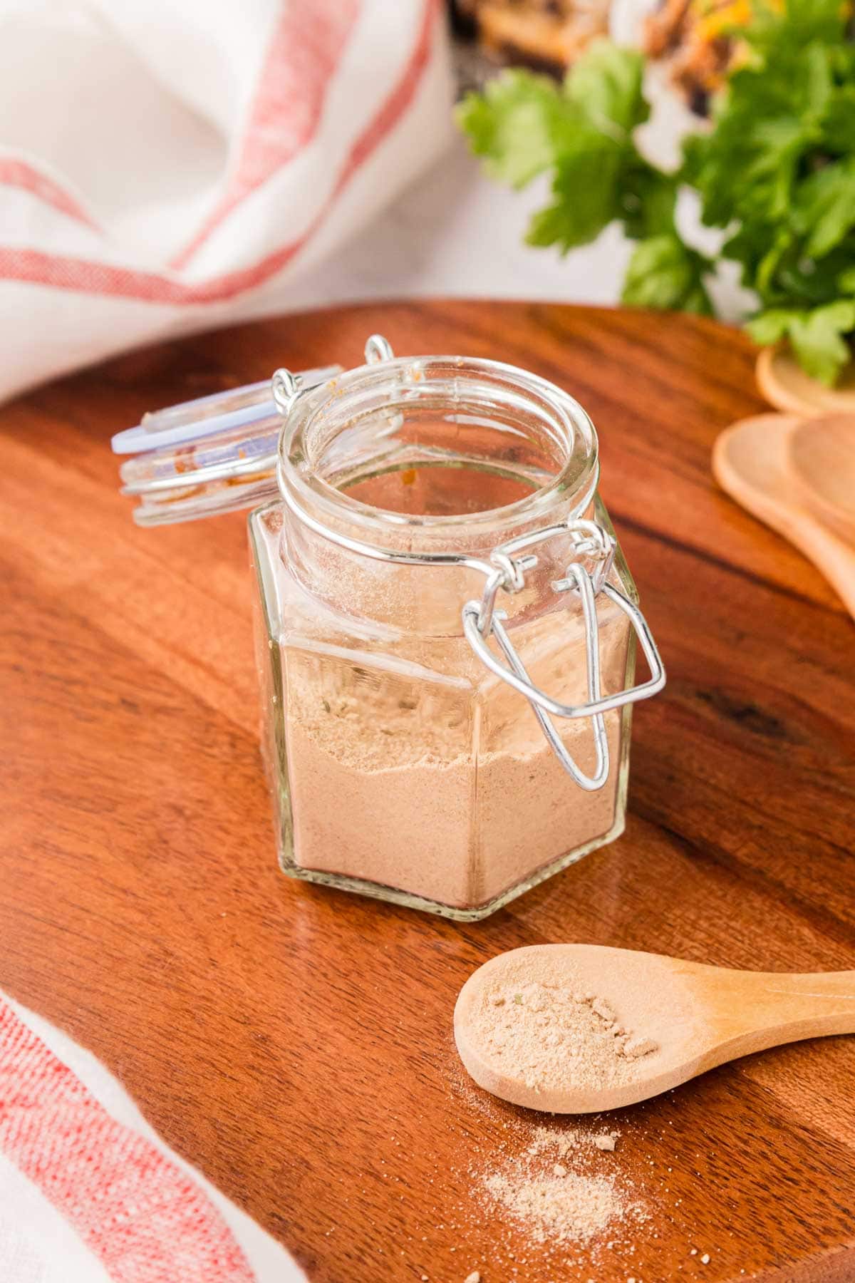 A spice spoon with a serving of dry onion soup mix.