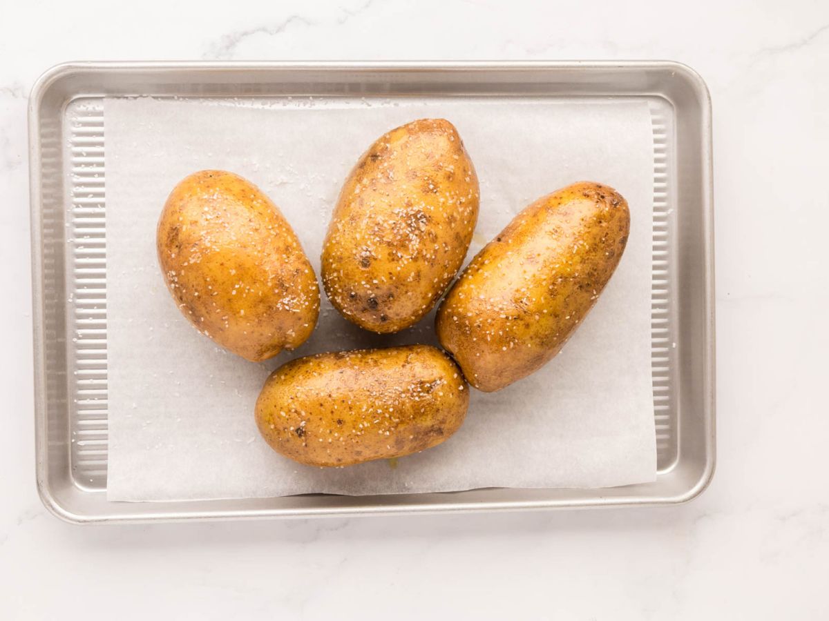 Salt rubbed on oil coated potatoes.