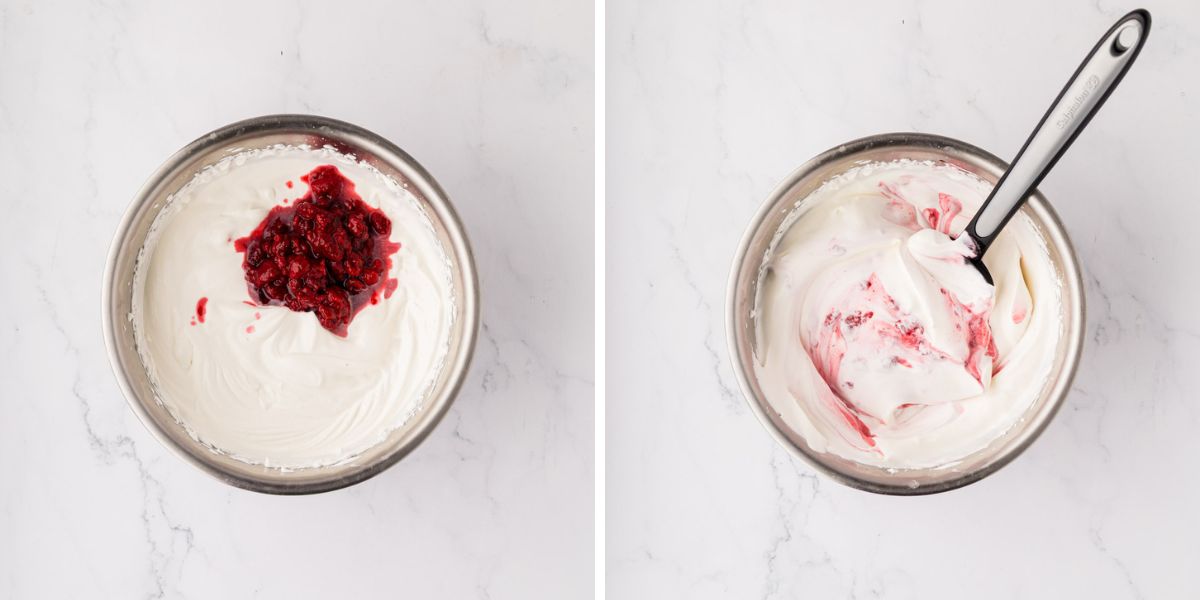A bowl with raspberries, folded into whipped cream.