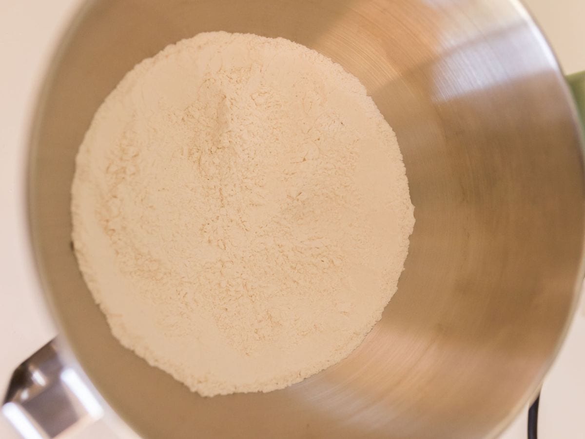 Measured dry ingredients in a mixing bowl.